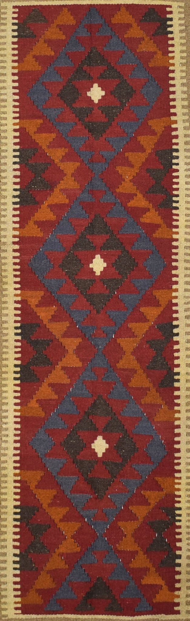 A handmade Afghan Maimana kilim runner featuring a geometric diamond pattern in red, blue, and orange.