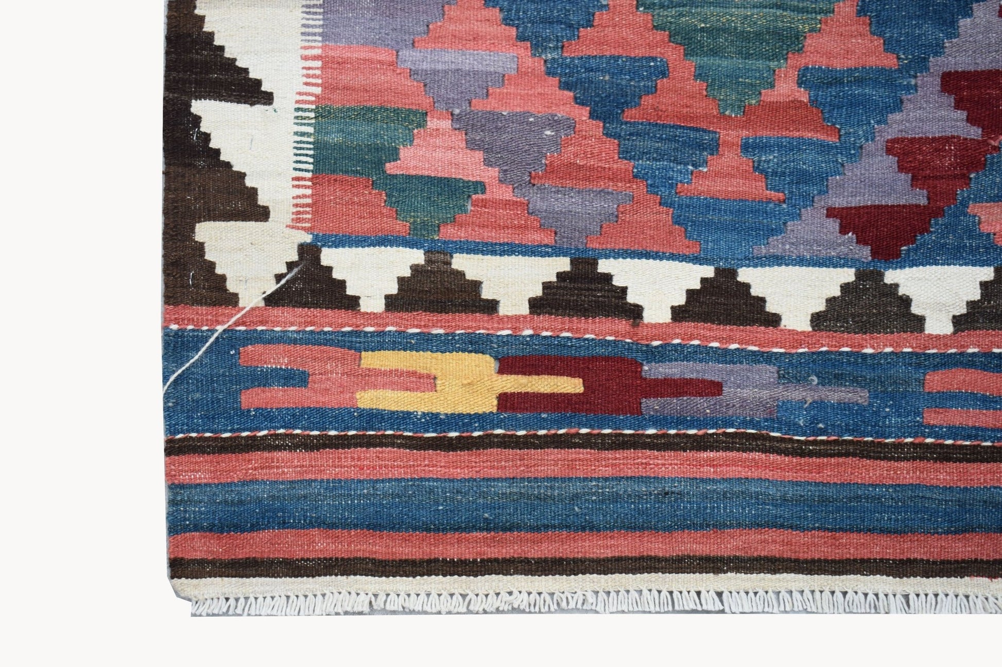 Handwoven Afghan Maimana kilim featuring a geometric pattern in vibrant wool colors.