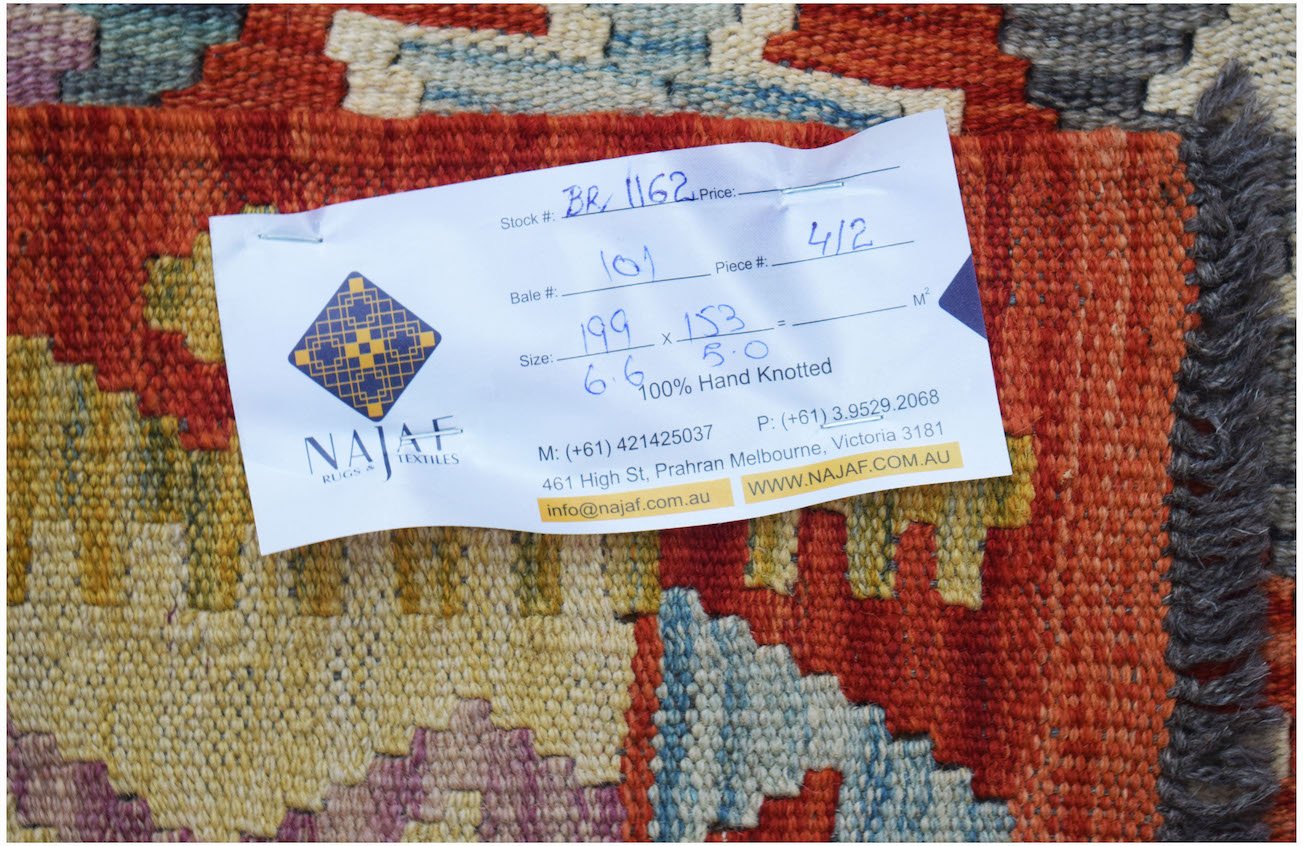 A flatwoven Afghan Maimana kilim featuring a vibrant geometric pattern in red, blue, and yellow.