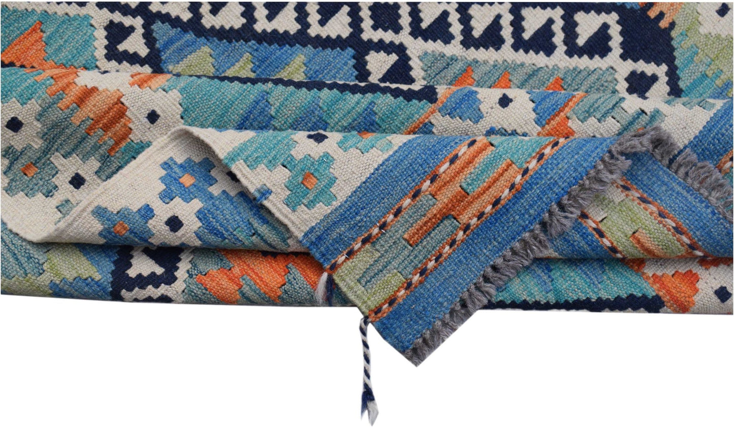 A handwoven Afghan Maimana kilim rug featuring a geometric pattern in blue, orange, and green.