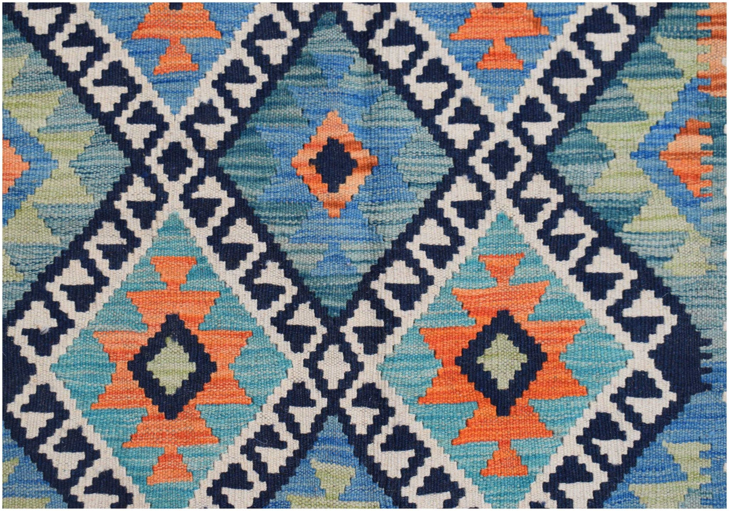 Handwoven Afghan Maimana kilim featuring a geometric diamond pattern in blue, orange, and cream.