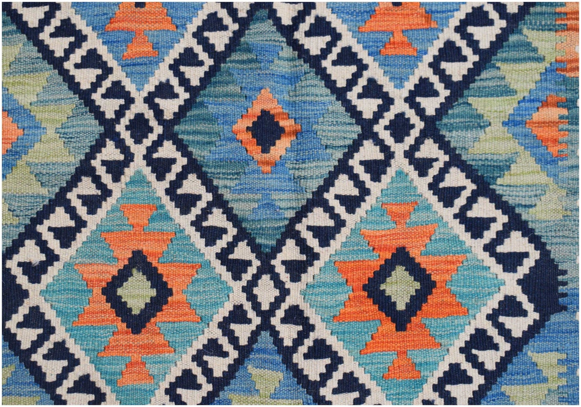Handwoven Afghan Maimana kilim featuring a geometric diamond pattern in blue, orange, and cream.