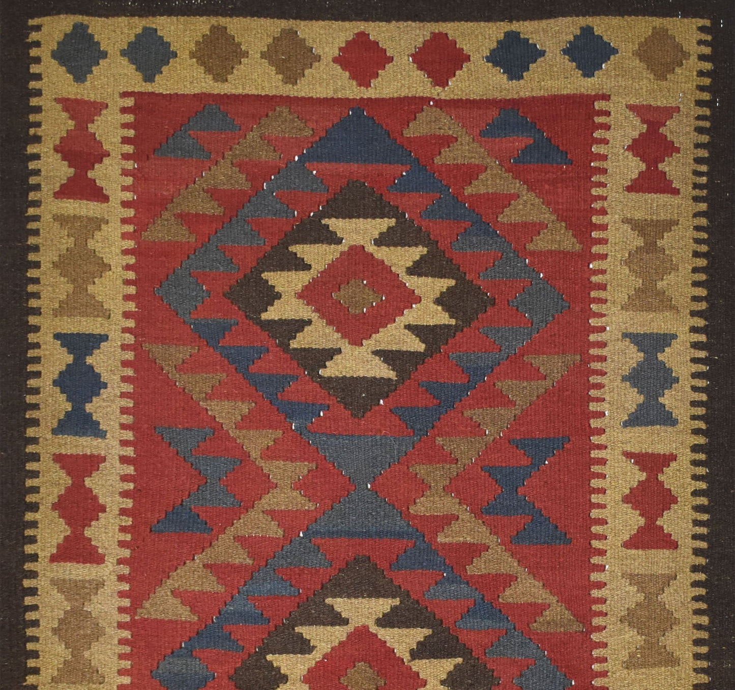Handmade Afghan Maimana kilim rug featuring a geometric diamond pattern in red, blue, and tan.