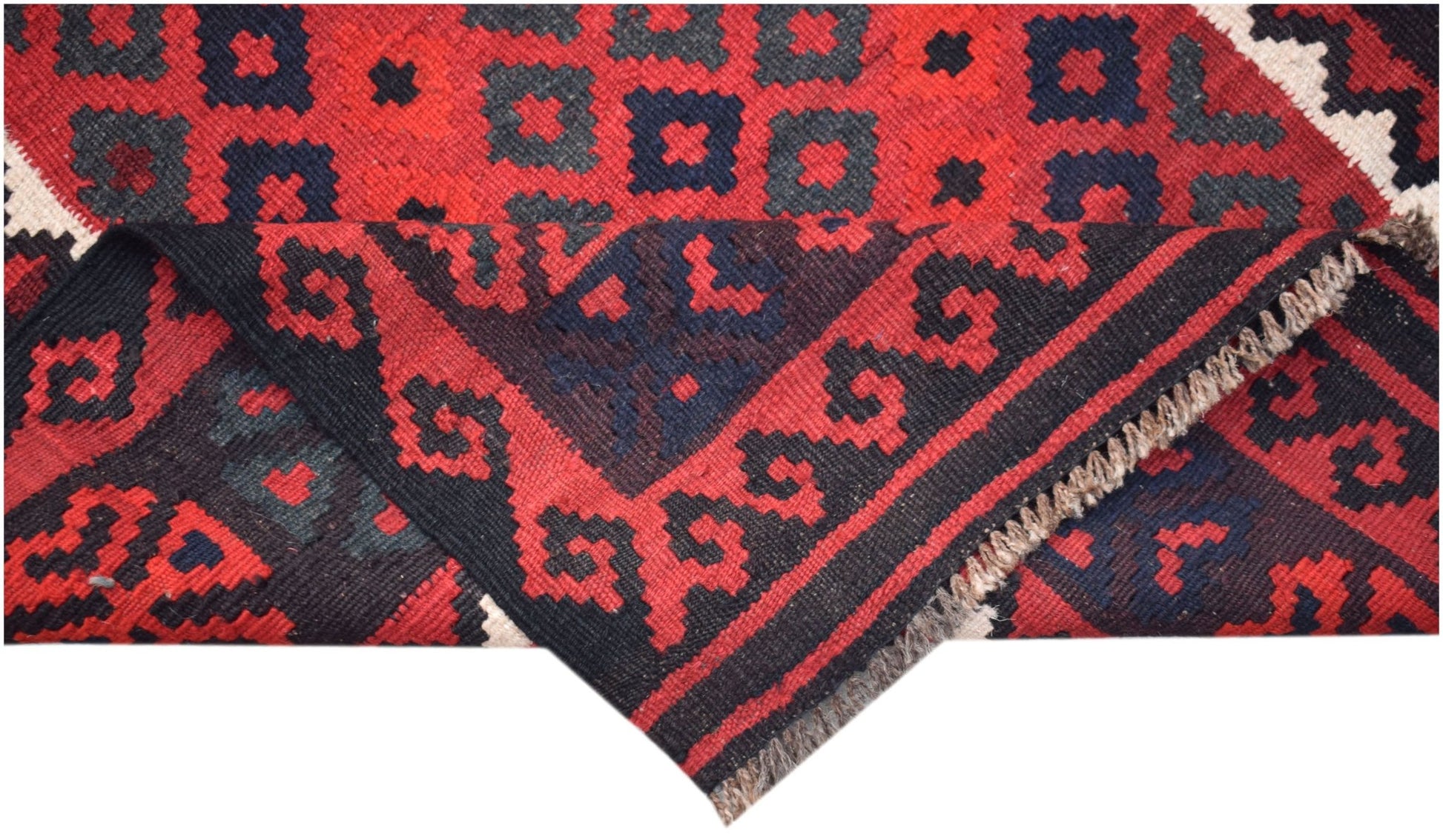 A handmade Afghan Maimana kilim featuring a geometric pattern in red and dark blue wool.