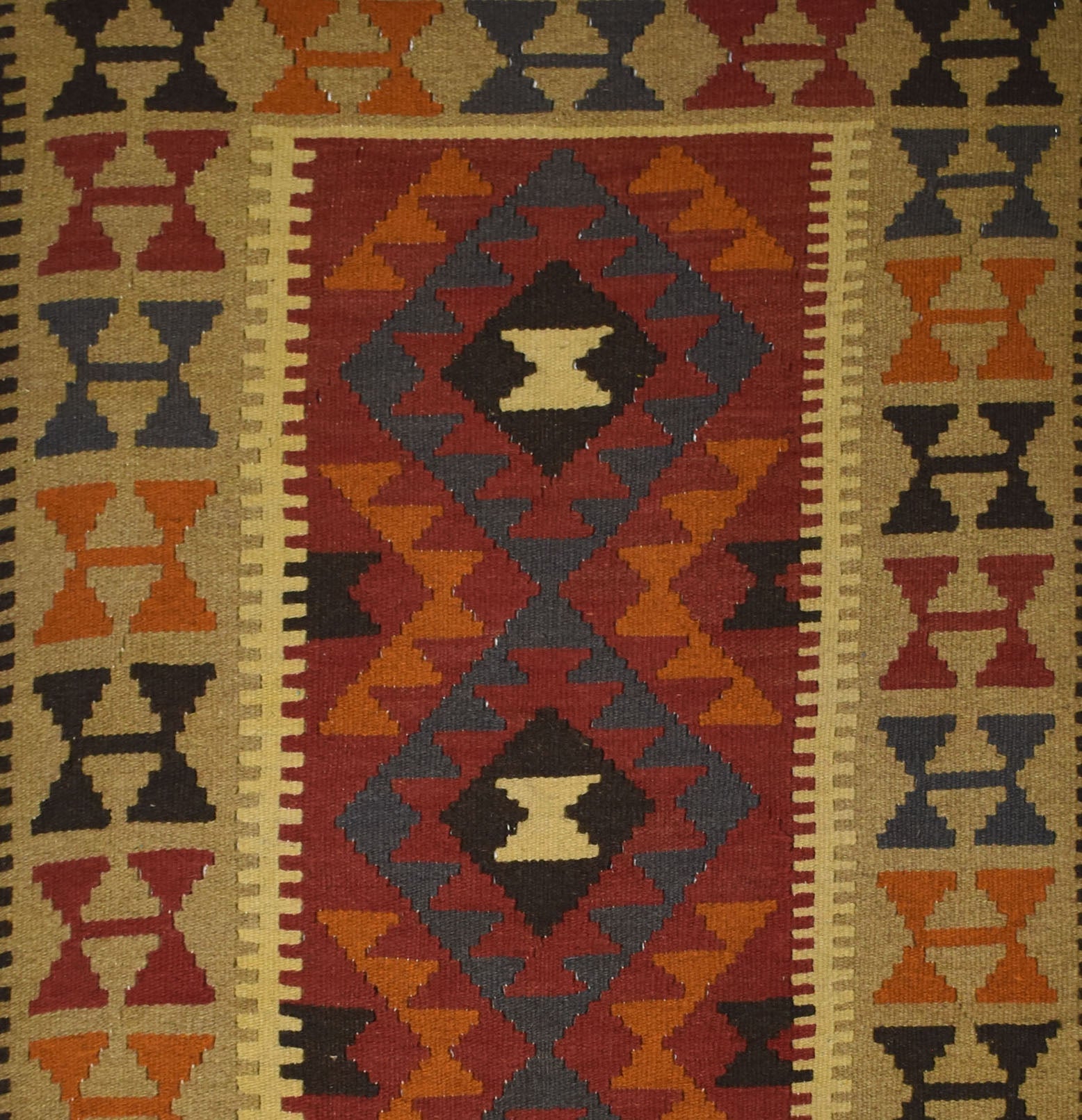 Handmade Afghan Maimana kilim rug featuring a geometric diamond pattern in red, orange, and grey.