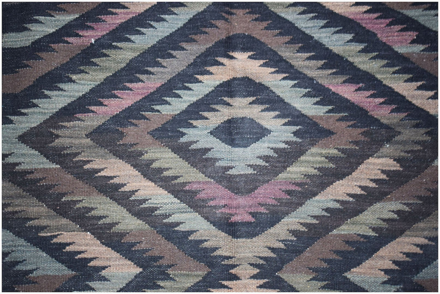 Handwoven Afghan Maimana kilim featuring a geometric diamond pattern in muted earth tones.