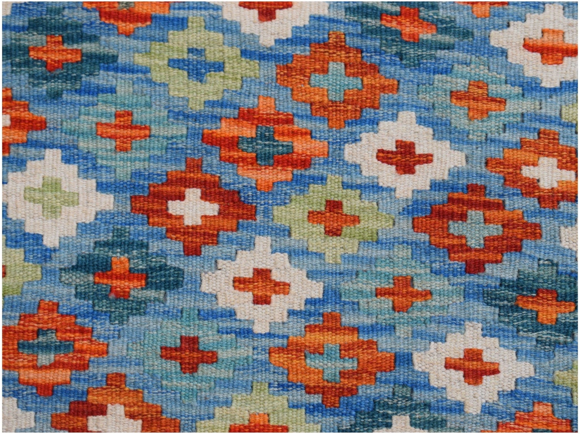Handwoven Afghan Maimana kilim featuring a geometric pattern of orange, blue, and cream diamonds.
