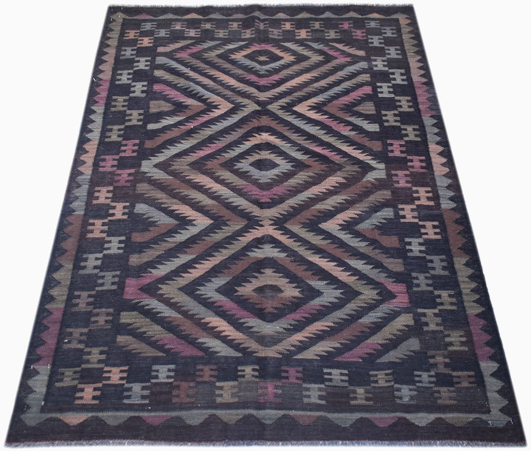 Handwoven Afghan Maimana kilim rug featuring a dark background with geometric diamond patterns.
