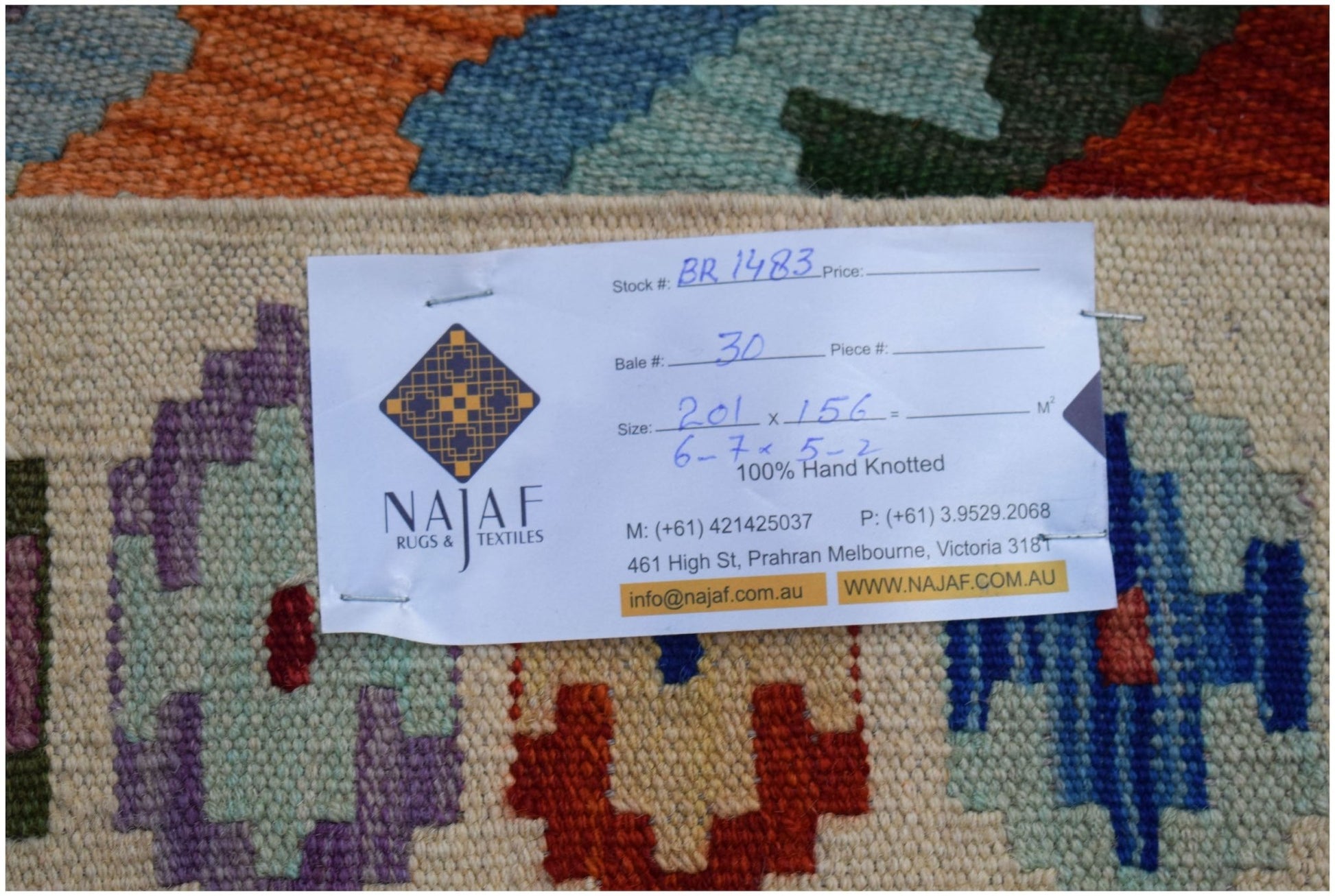 A handmade Afghan Maimana Kilim featuring a colorful geometric pattern on a flatweave wool surface.