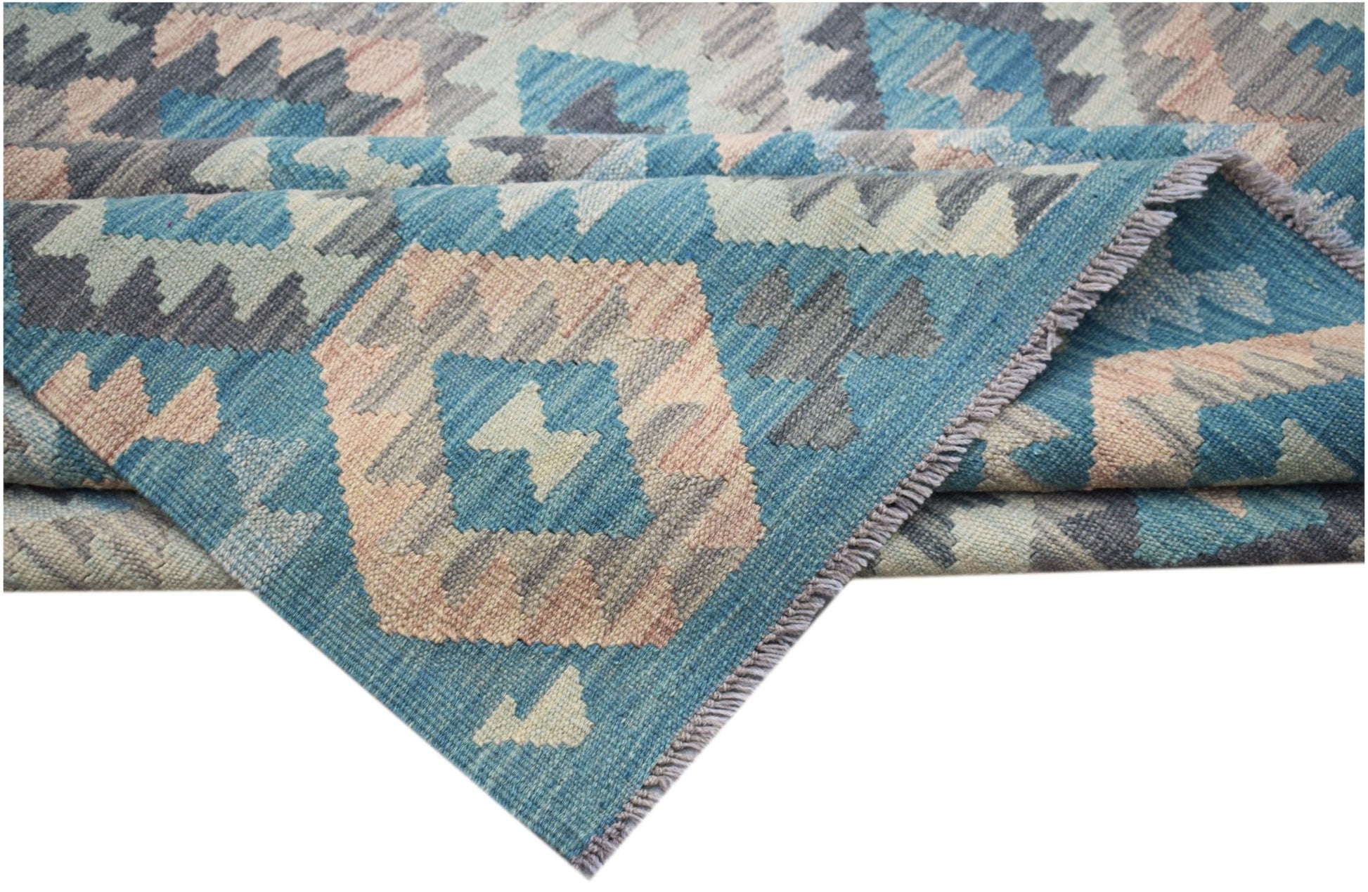 A handmade Afghan Maimana kilim rug featuring a geometric pattern in blue, grey, and beige tones.