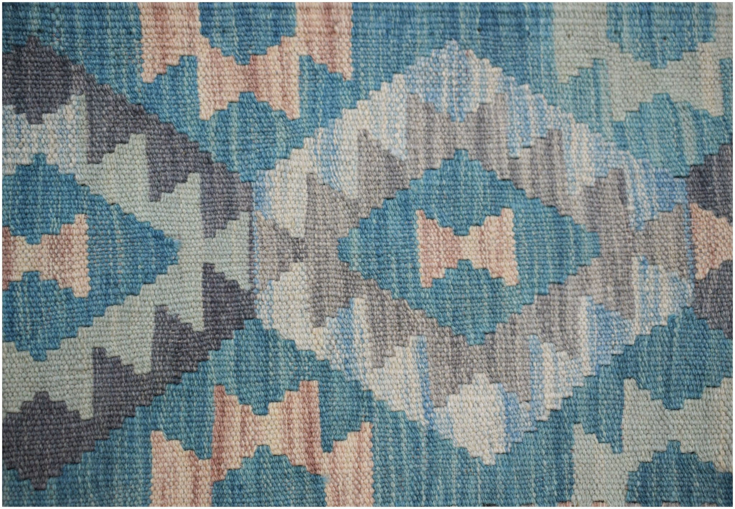 Handwoven Afghan Maimana kilim rug featuring a geometric diamond pattern in blue and beige tones.