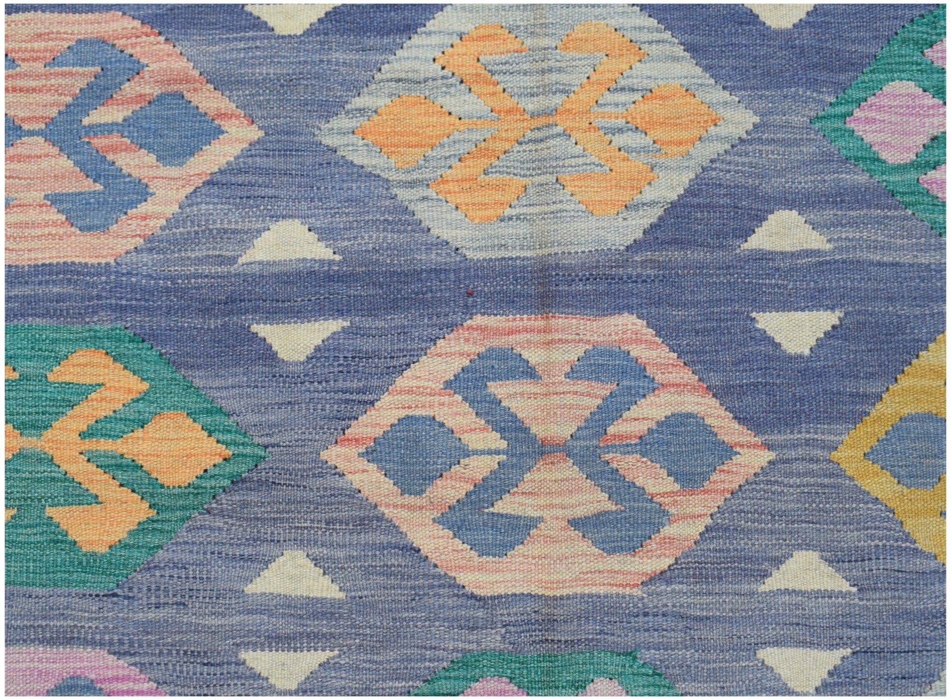 Handwoven Afghan Maimana kilim featuring a blue background with colorful geometric diamond motifs.