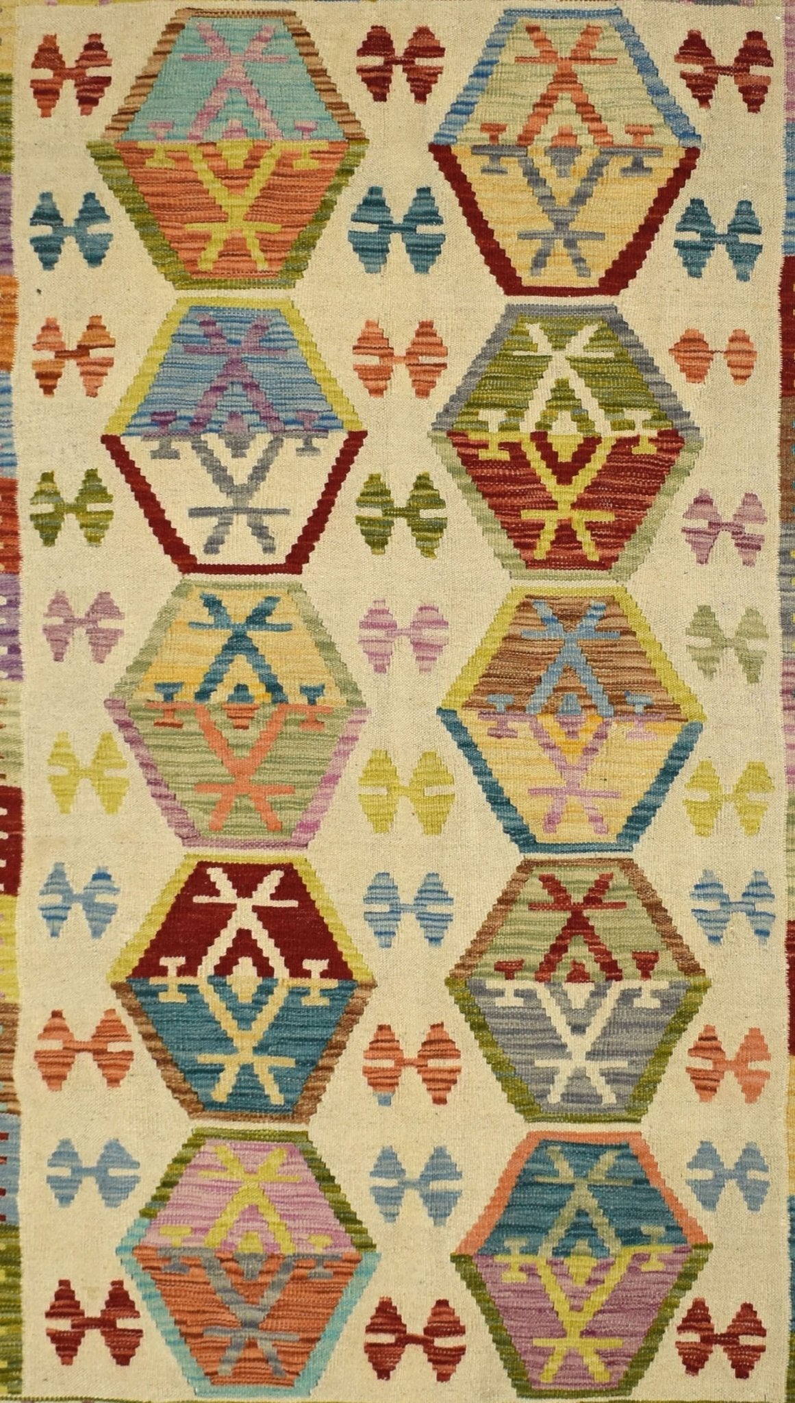 Handmade Afghan Maimana kilim rug featuring a repeating pattern of colorful geometric hexagons.