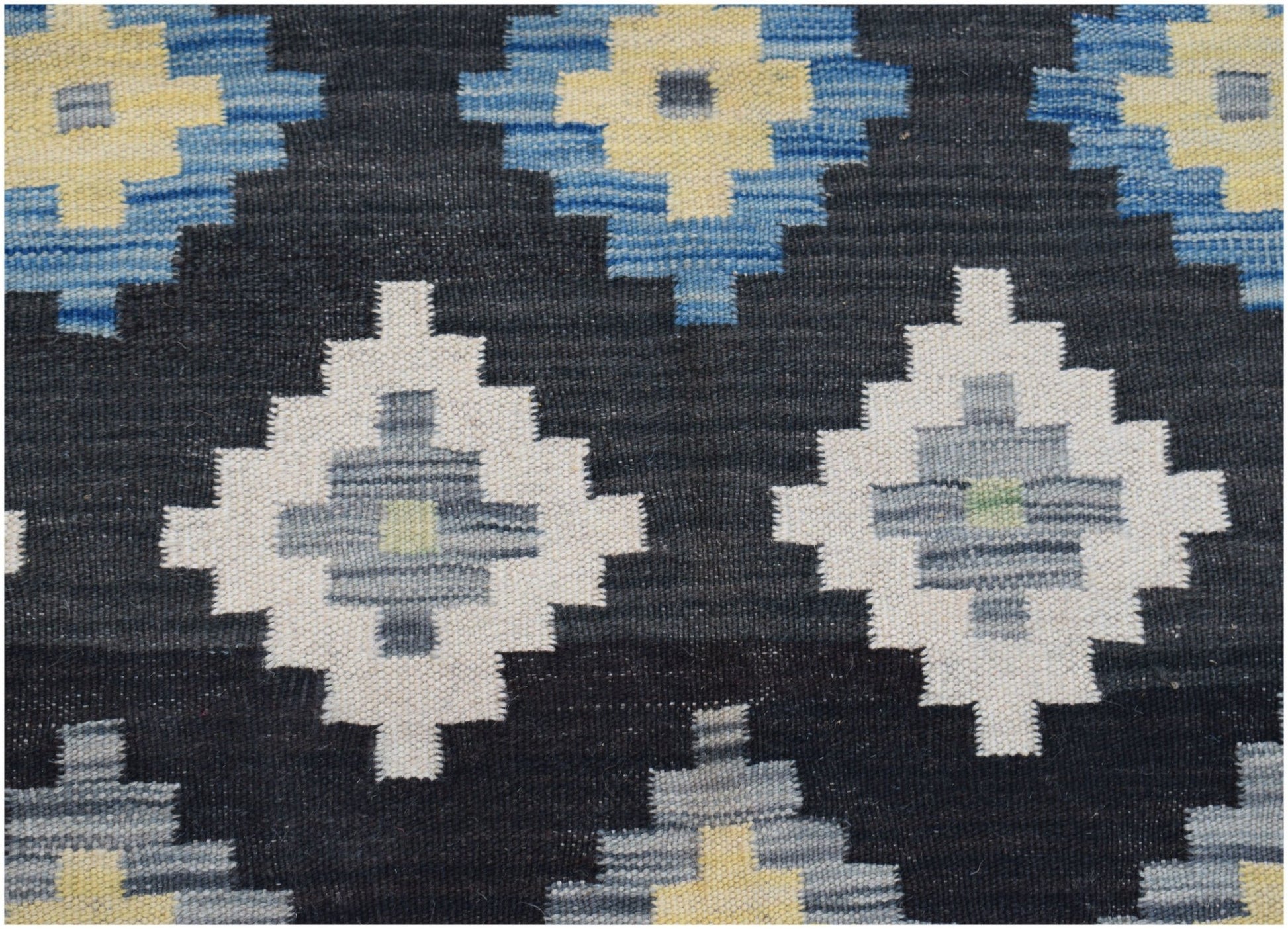 Handwoven Afghan Maimana kilim featuring a geometric diamond pattern in blue, cream, and grey.