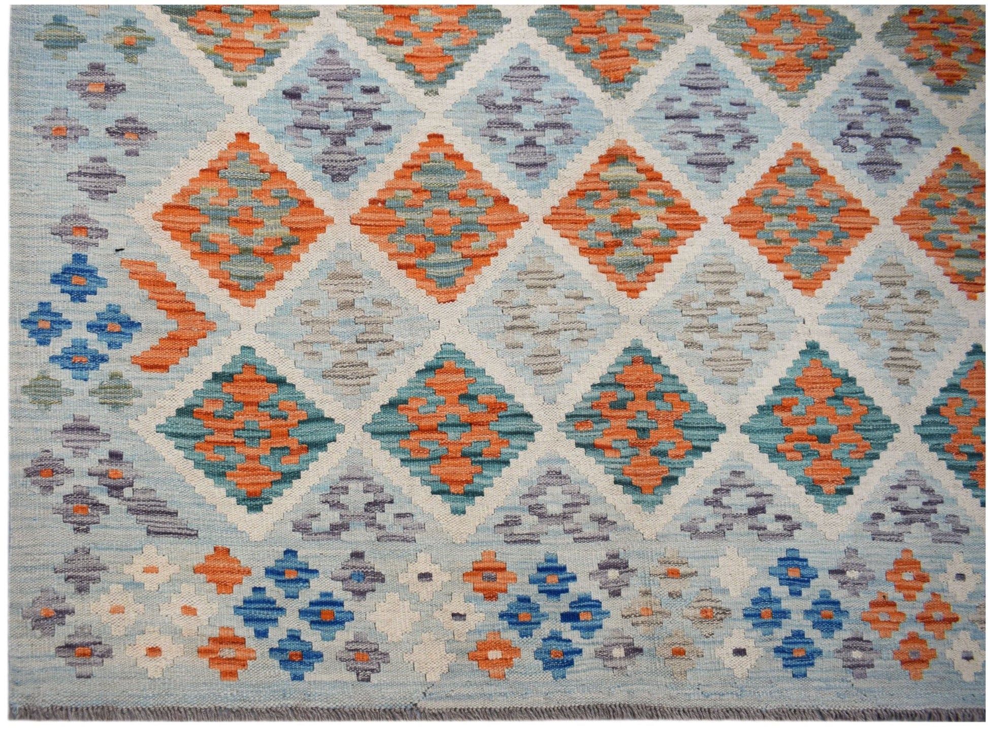 Handwoven Afghan Maimana kilim featuring a geometric diamond pattern in orange, blue, and grey.