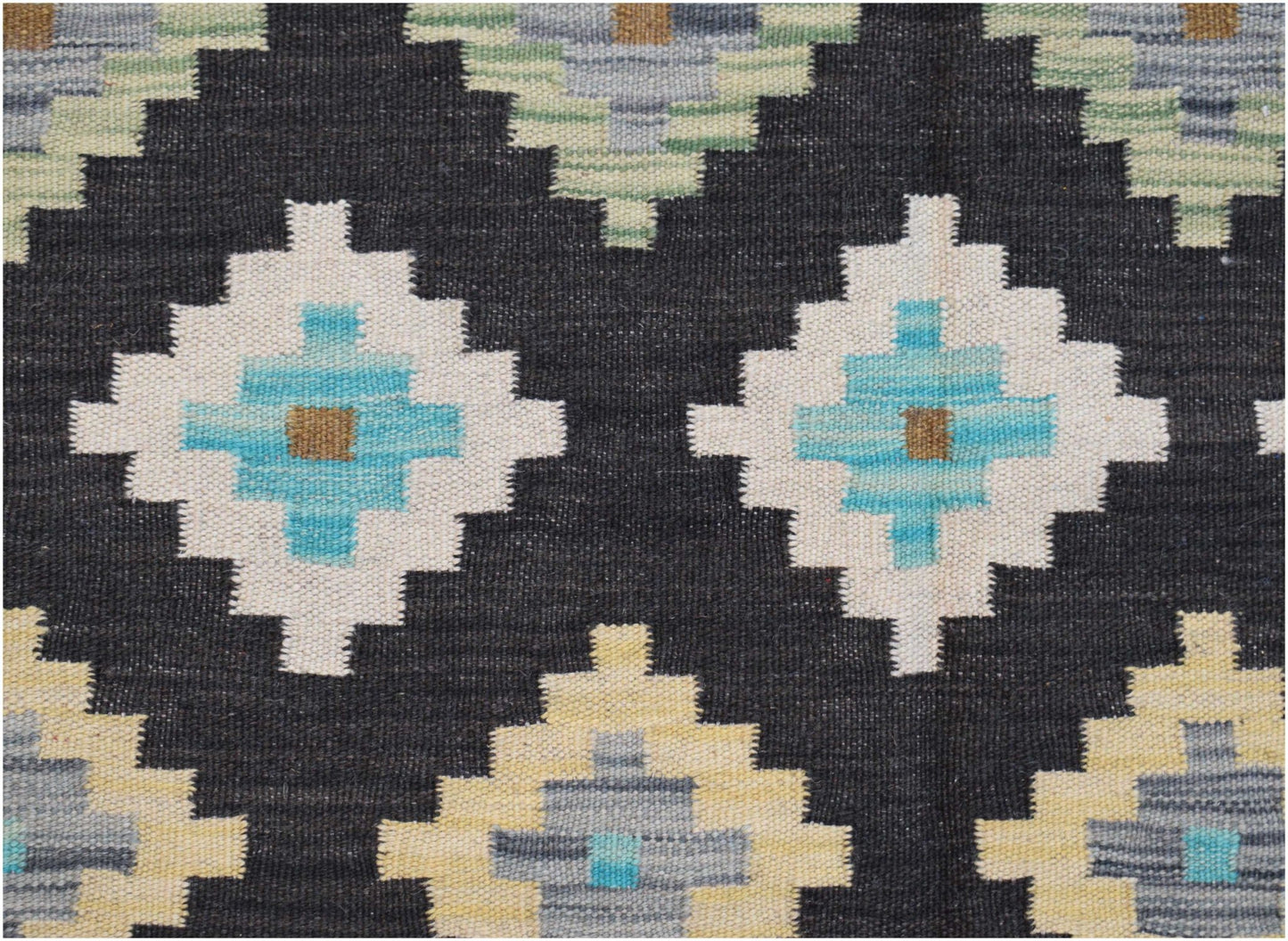 Handwoven Afghan Maimana kilim featuring a geometric diamond pattern in blue, cream, and grey.