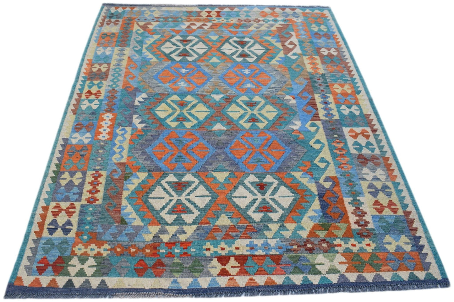 Handwoven Afghan Maimana kilim rug featuring a vibrant geometric pattern in wool.