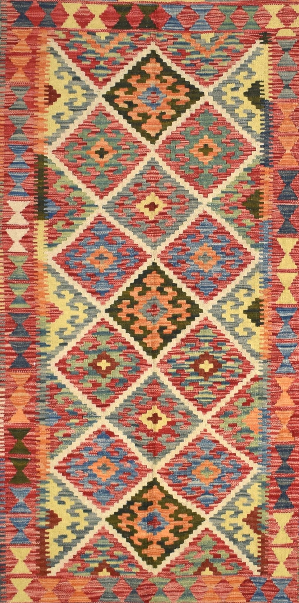 Handmade Afghan Maimana kilim rug featuring a colorful geometric diamond pattern in natural wool.
