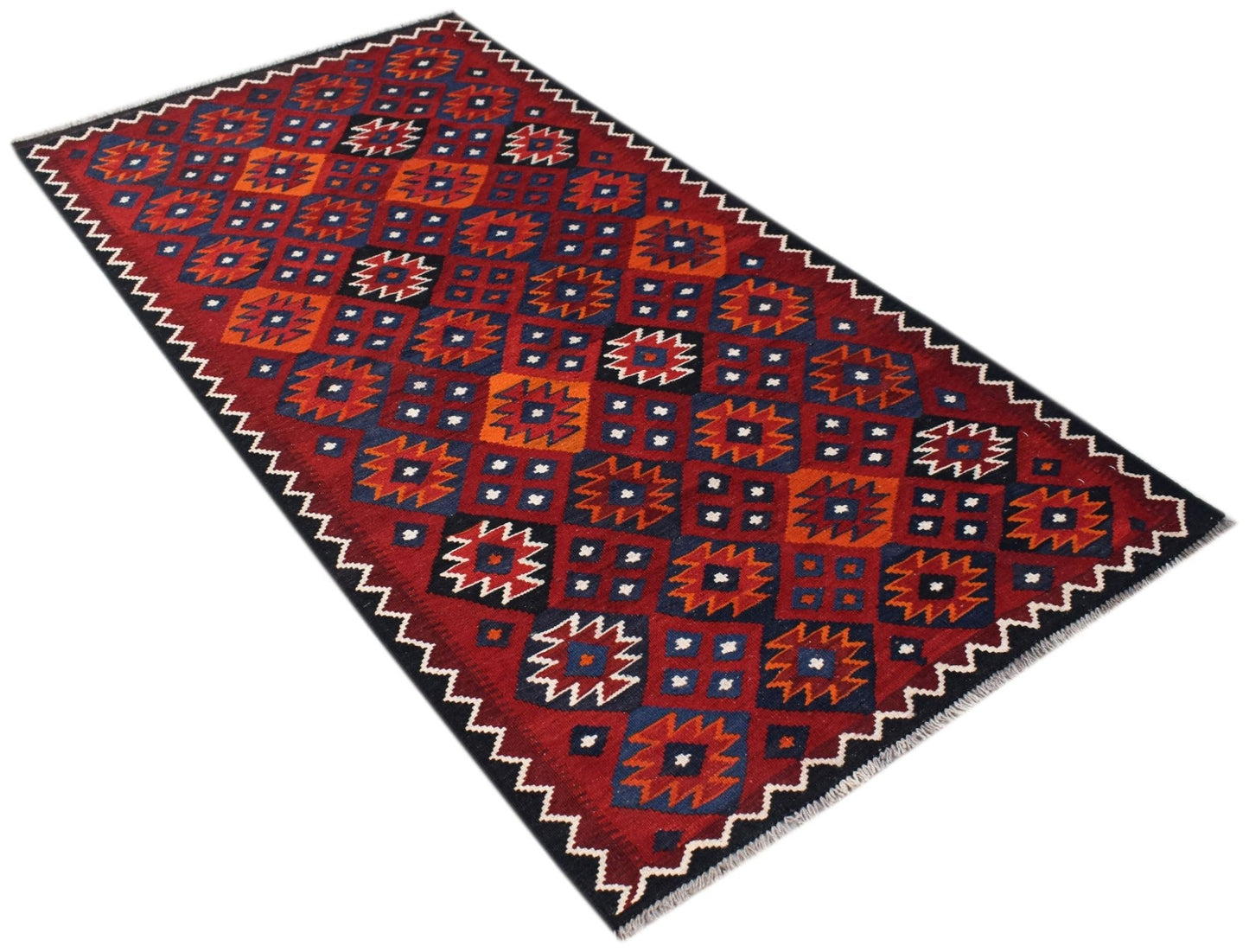 Handwoven Afghan Maimana kilim featuring a geometric pattern in red, blue, and orange wool.