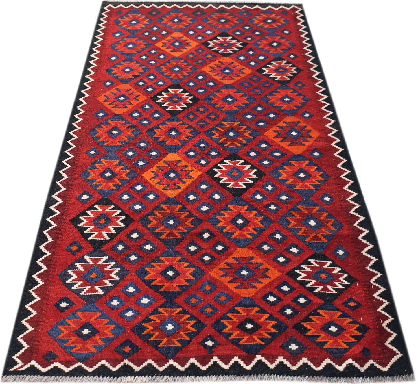 Handwoven Afghan Maimana kilim runner featuring a geometric diamond pattern in red, blue, and orange.