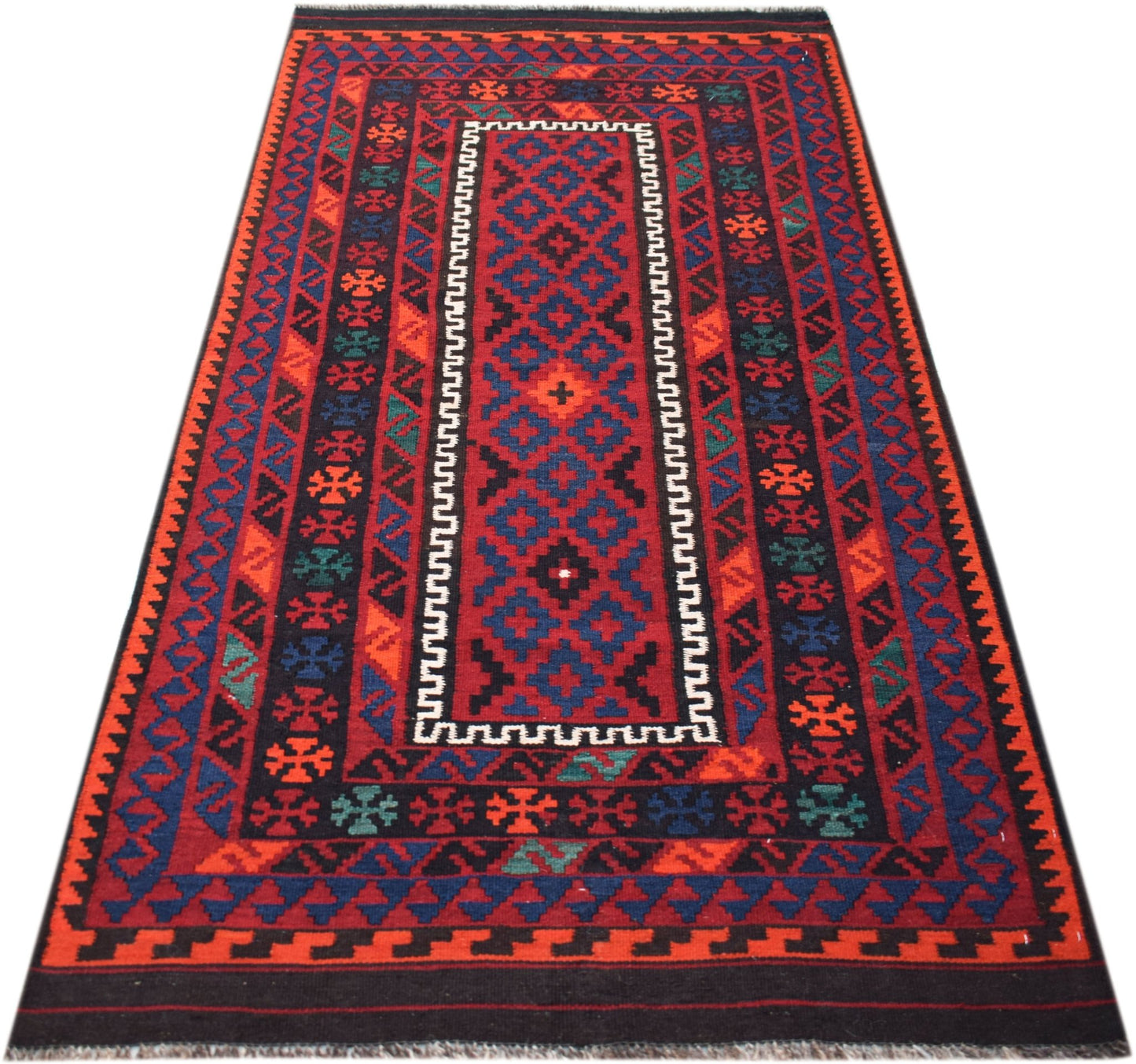 Handwoven Afghan Maimana kilim rug featuring a geometric pattern in red, blue, and black wool.
