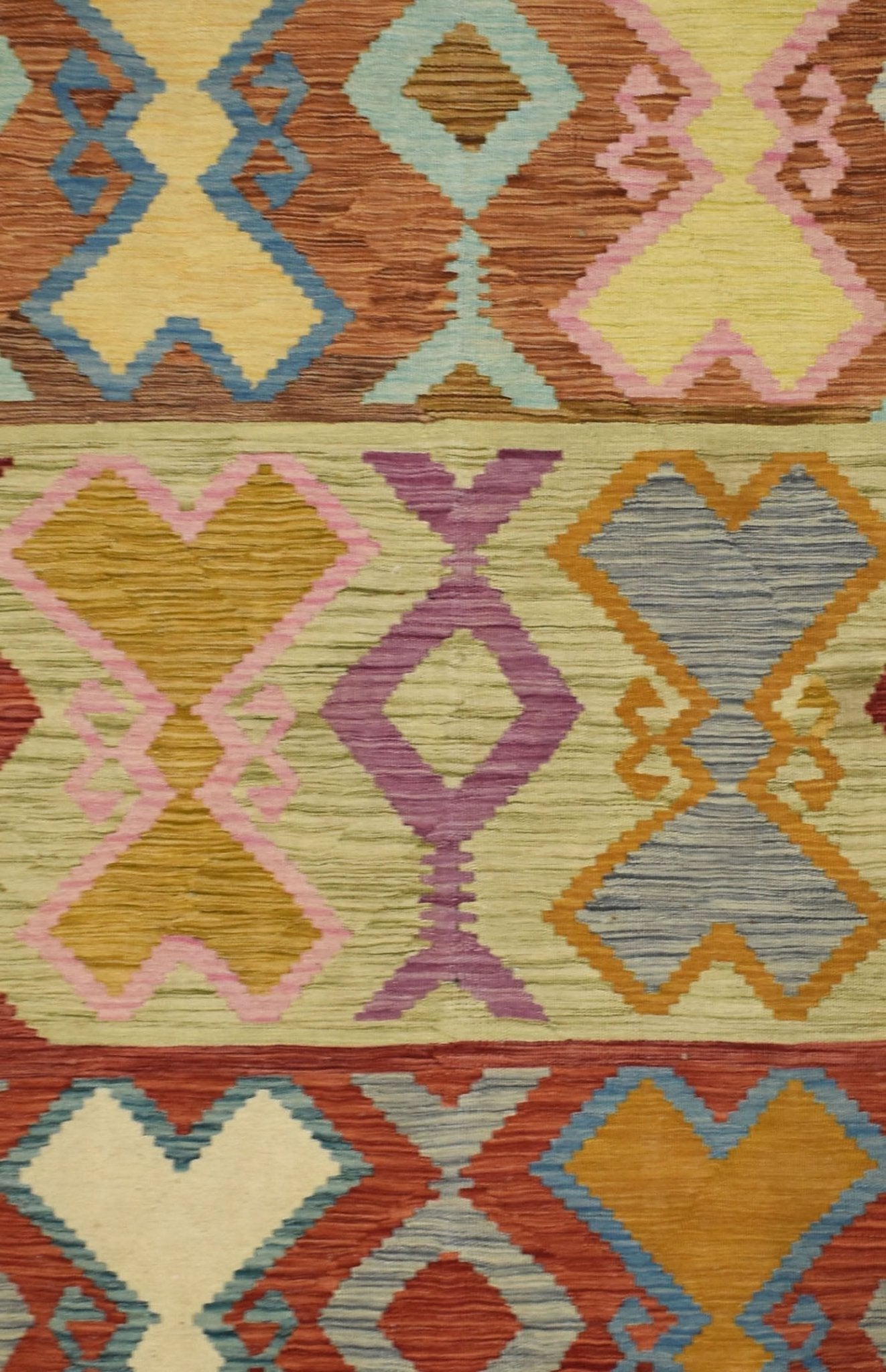 Handmade Afghan Maimana kilim rug featuring a vibrant geometric pattern in multi-colored wool.