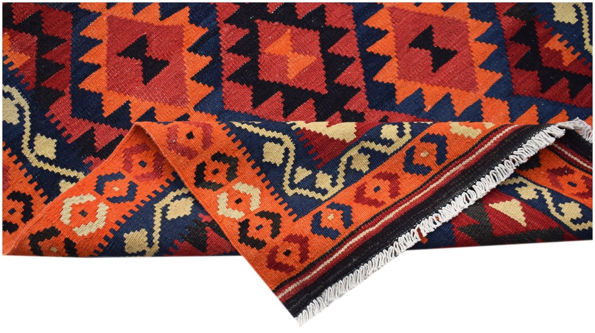 Handwoven Afghan Maimana kilim featuring geometric patterns in red, blue, and cream wool.