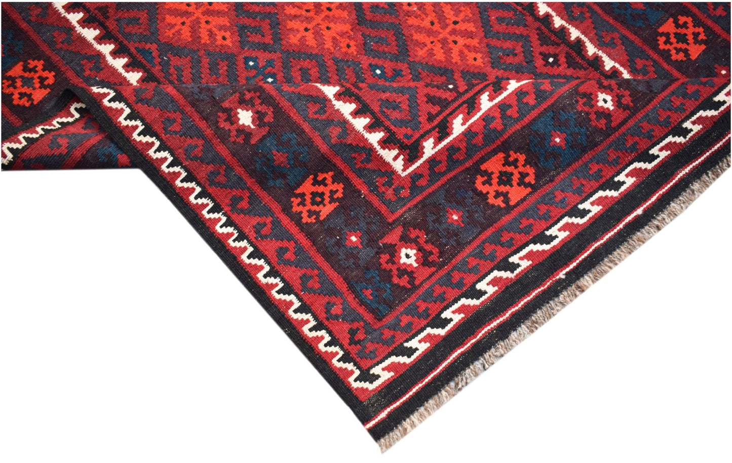 A handmade Afghan Maimana kilim featuring geometric patterns in red, blue, and white wool.