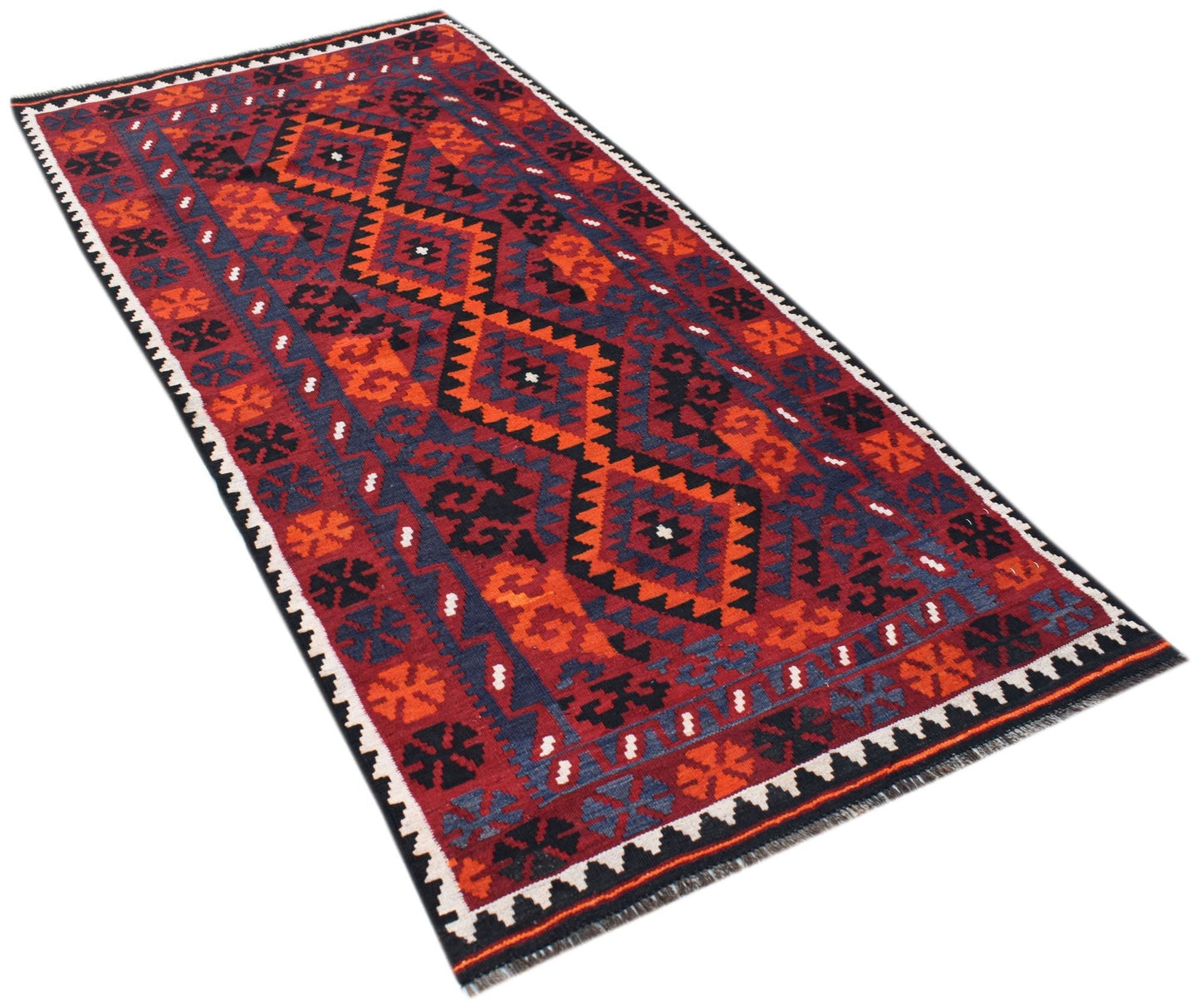 A rectangular Afghan Maimana kilim rug featuring a geometric pattern in red, orange, and black.