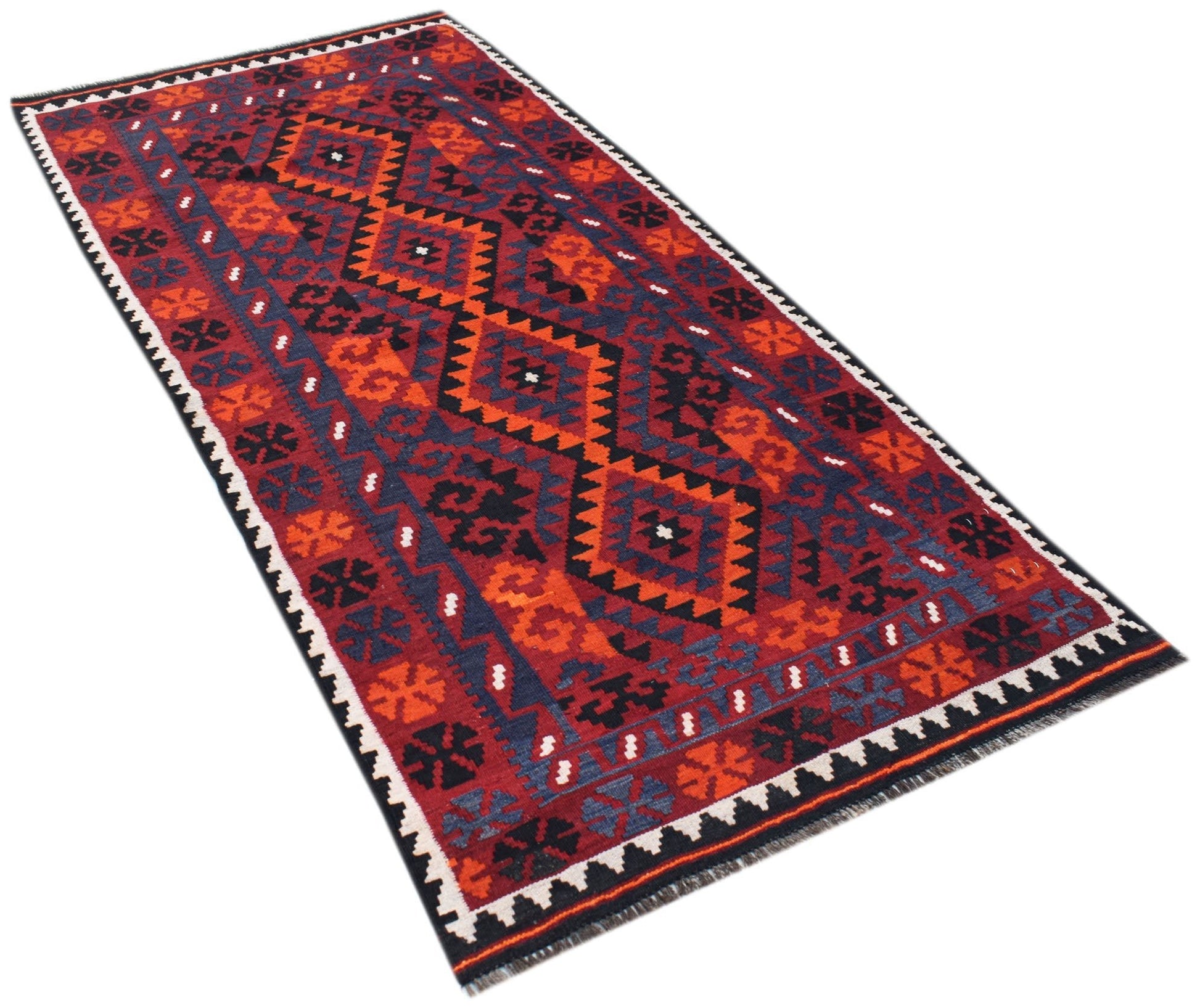 A rectangular Afghan Maimana kilim rug featuring a geometric pattern in red, orange, and black.