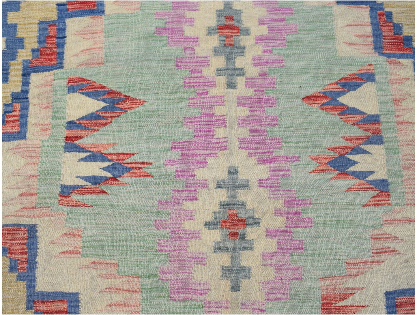 Handwoven Afghan Maimana kilim featuring a geometric pattern in pastel and primary colors.