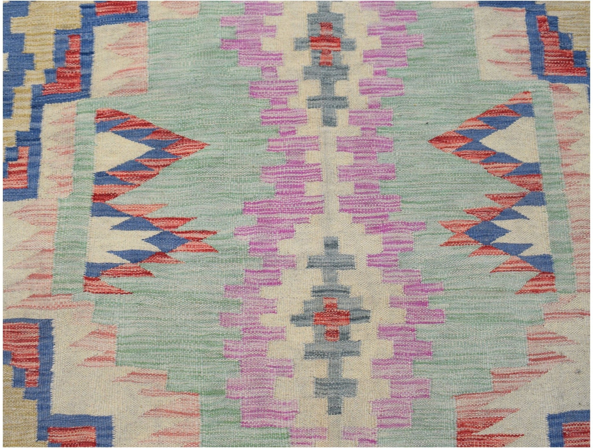 Handwoven Afghan Maimana kilim featuring a geometric pattern in pastel and primary colors.