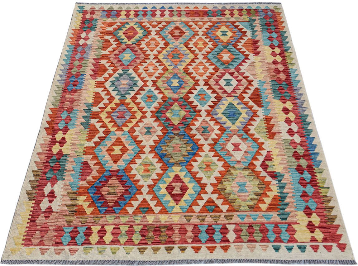 Handwoven Afghan Maimana kilim rug featuring a colorful geometric diamond pattern in wool.