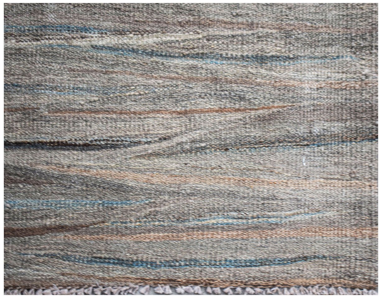 Handwoven Afghan Maimana wool kilim featuring a textured grey surface with subtle blue and tan streaks.