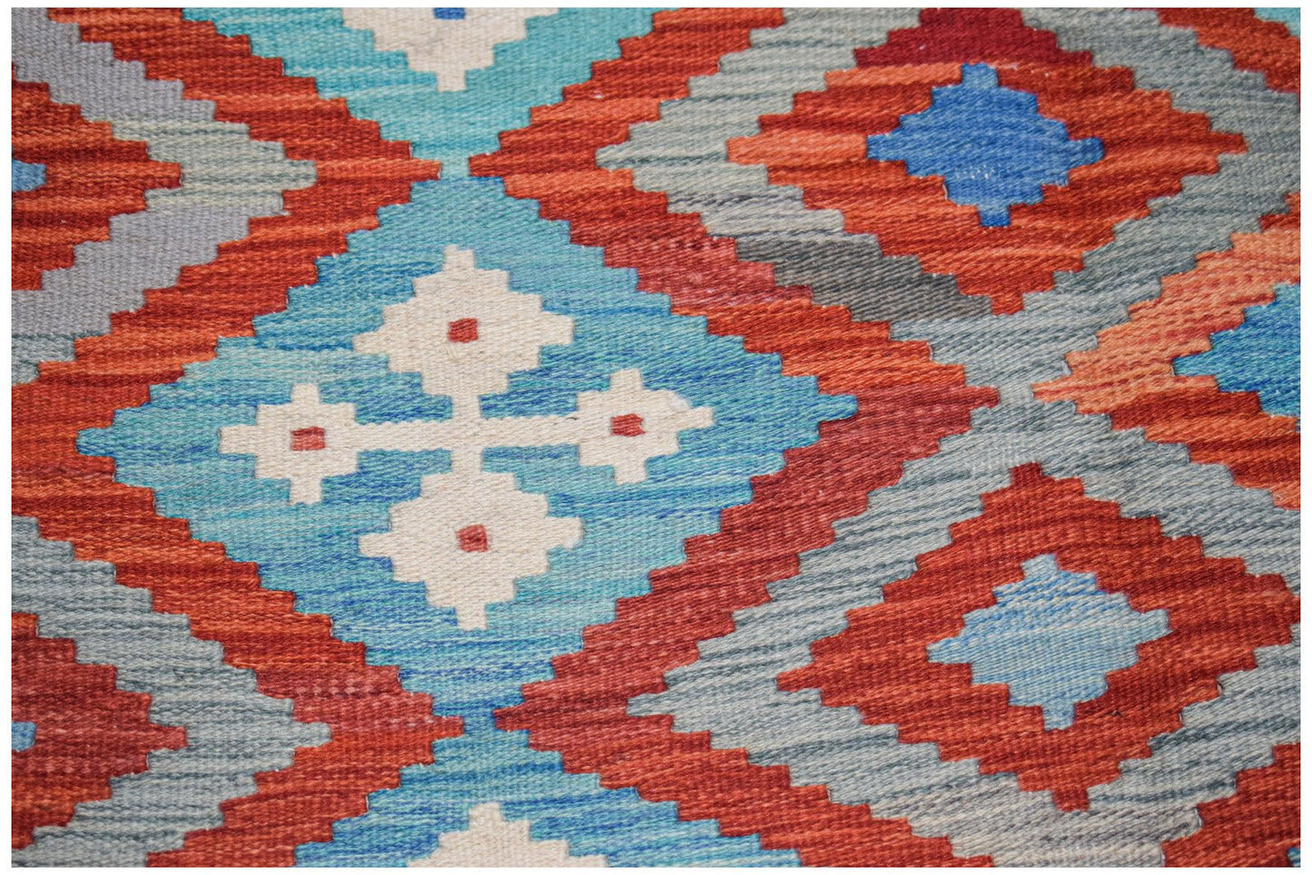 Afghan Maimana Kilim with geometric patterns in red, blue, and white.