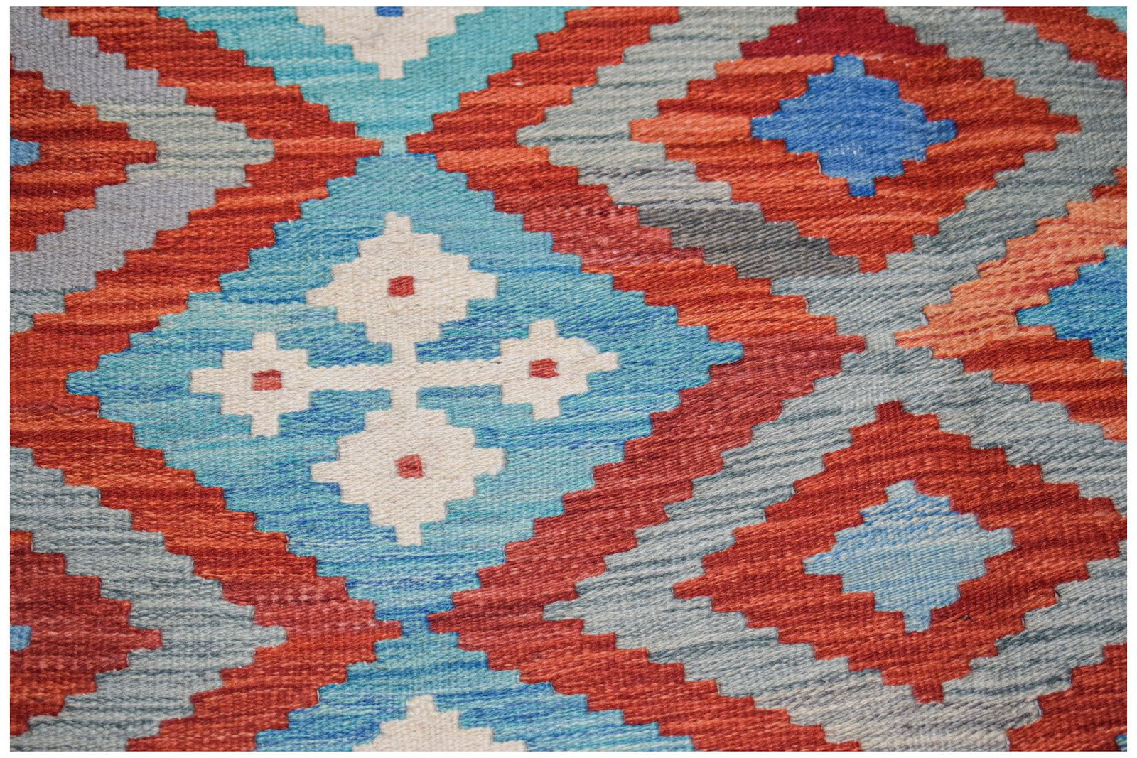 Afghan Maimana Kilim with geometric patterns in red, blue, and white.