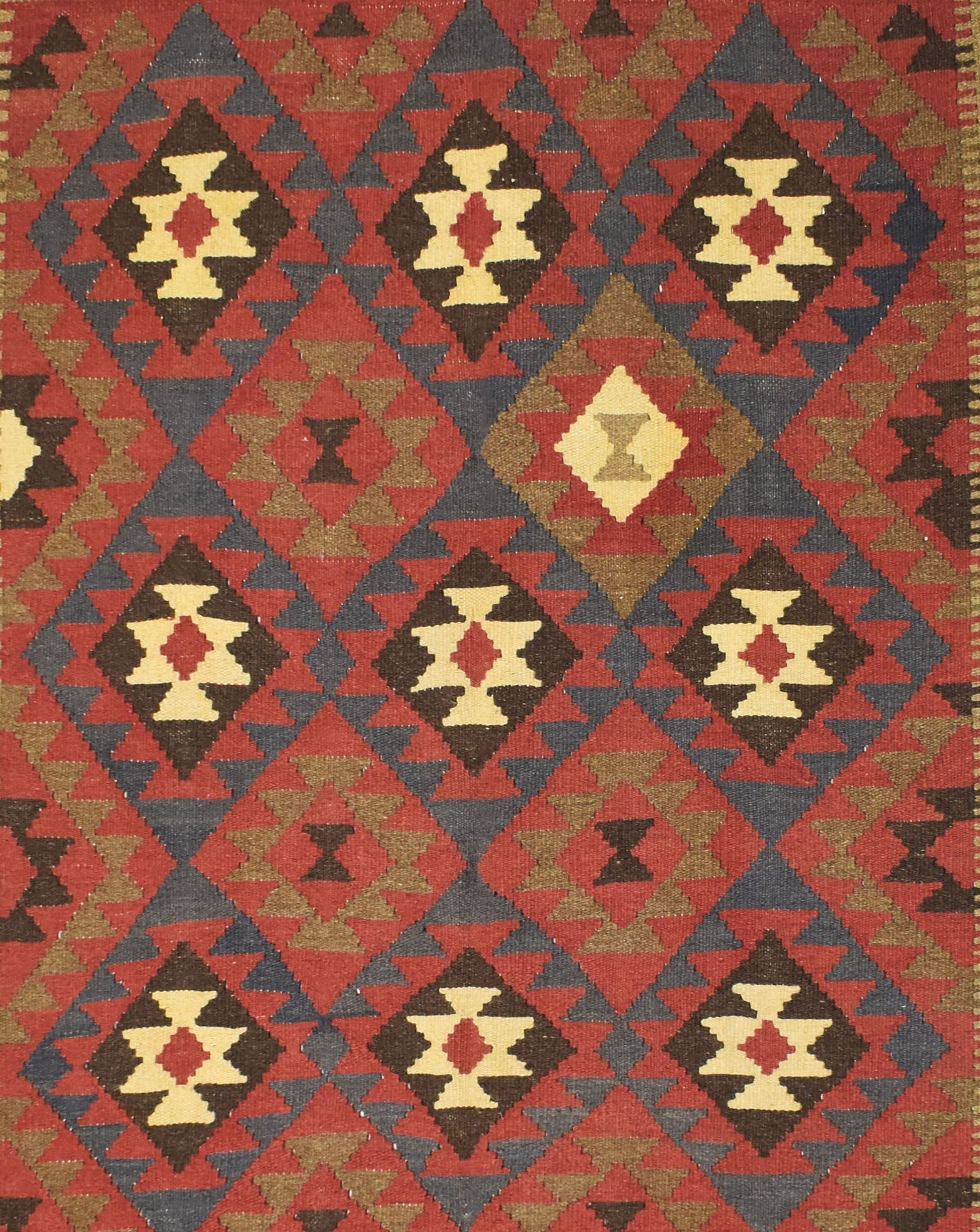 Handmade Afghan Maimana kilim rug featuring a repeating geometric diamond pattern in earthy tones.