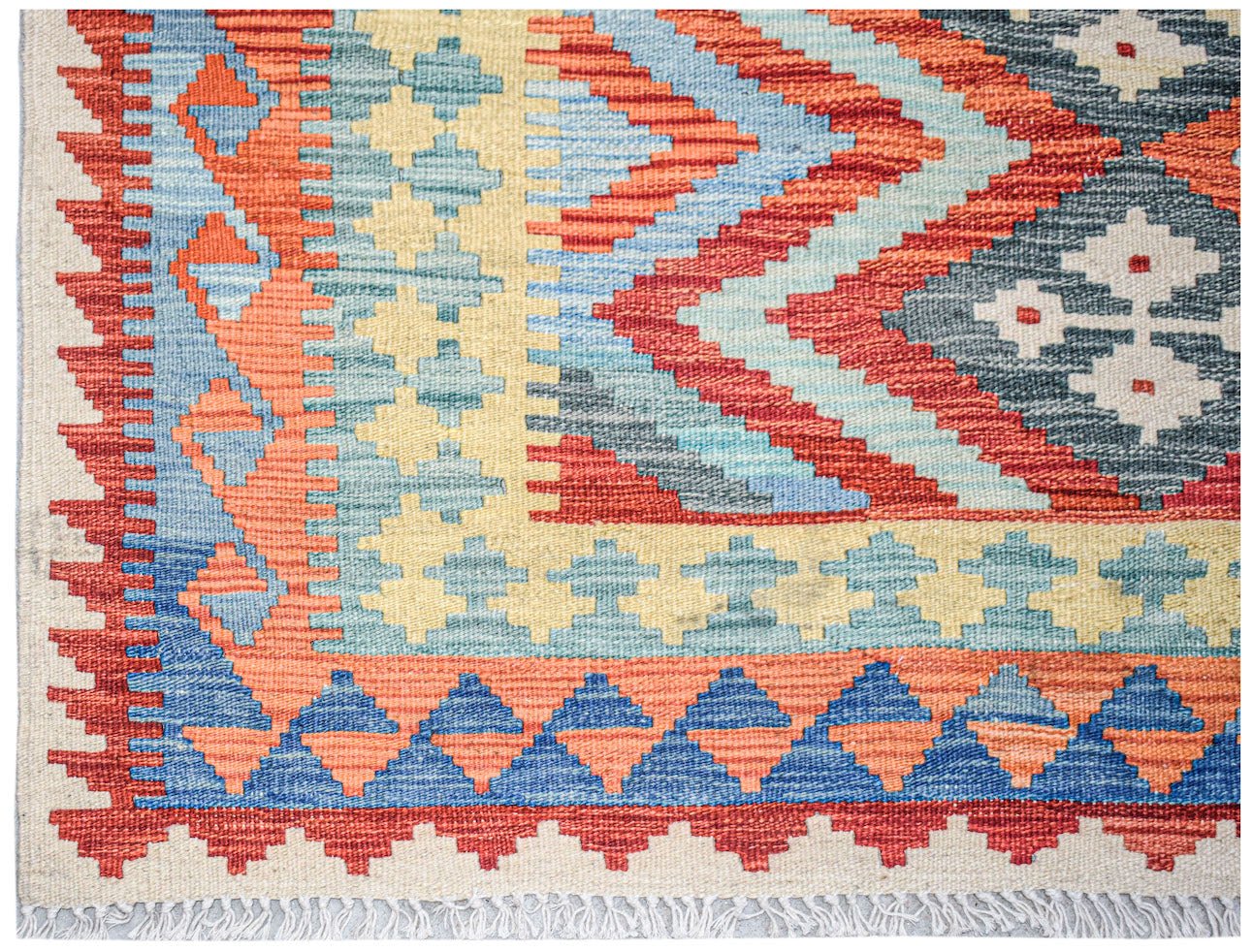 Afghan Maimana Kilim with geometric patterns in red, blue, and yellow.