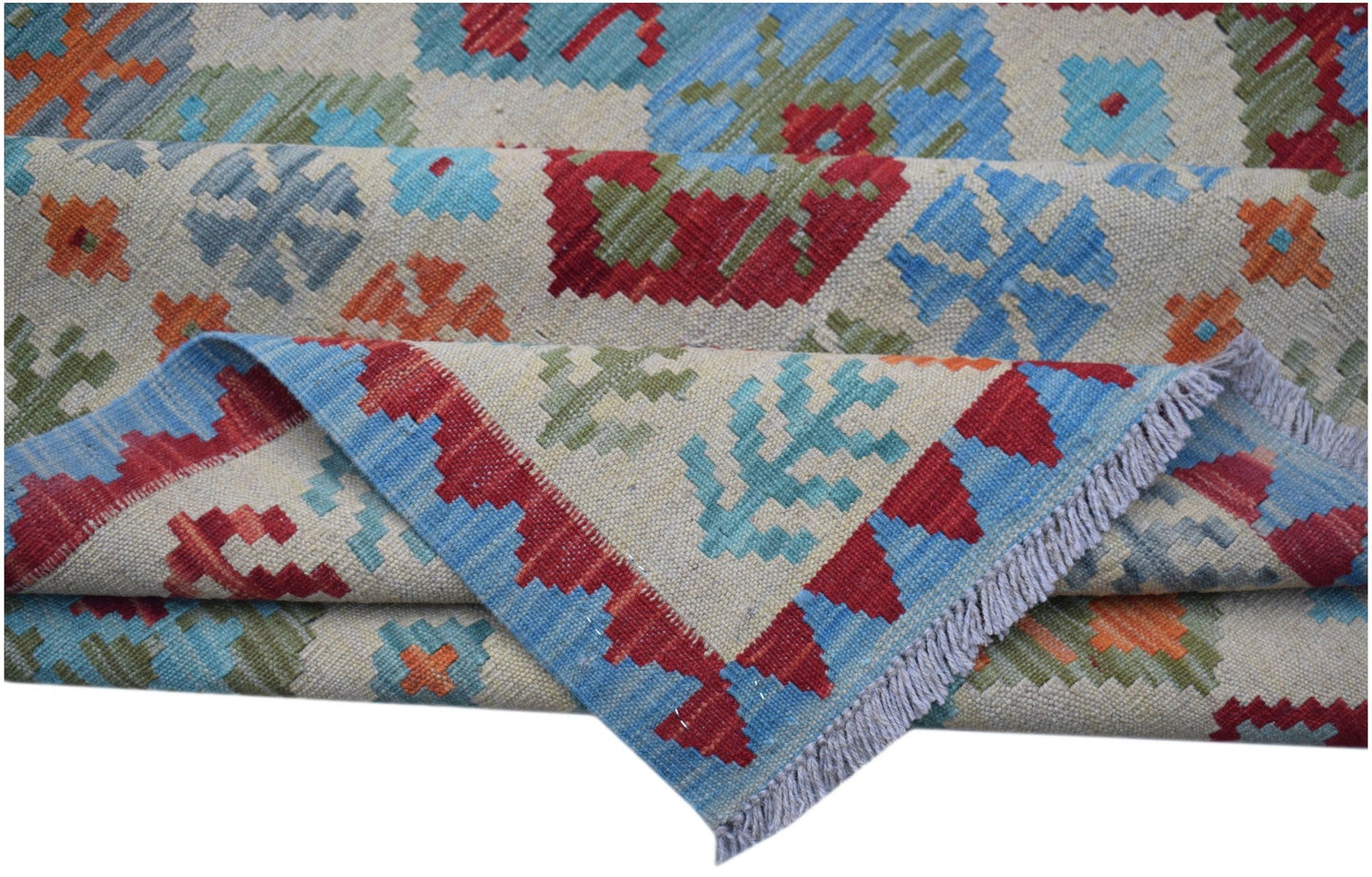 Handwoven Afghan Maimana kilim rug featuring a geometric pattern in red, blue, green, and orange.
