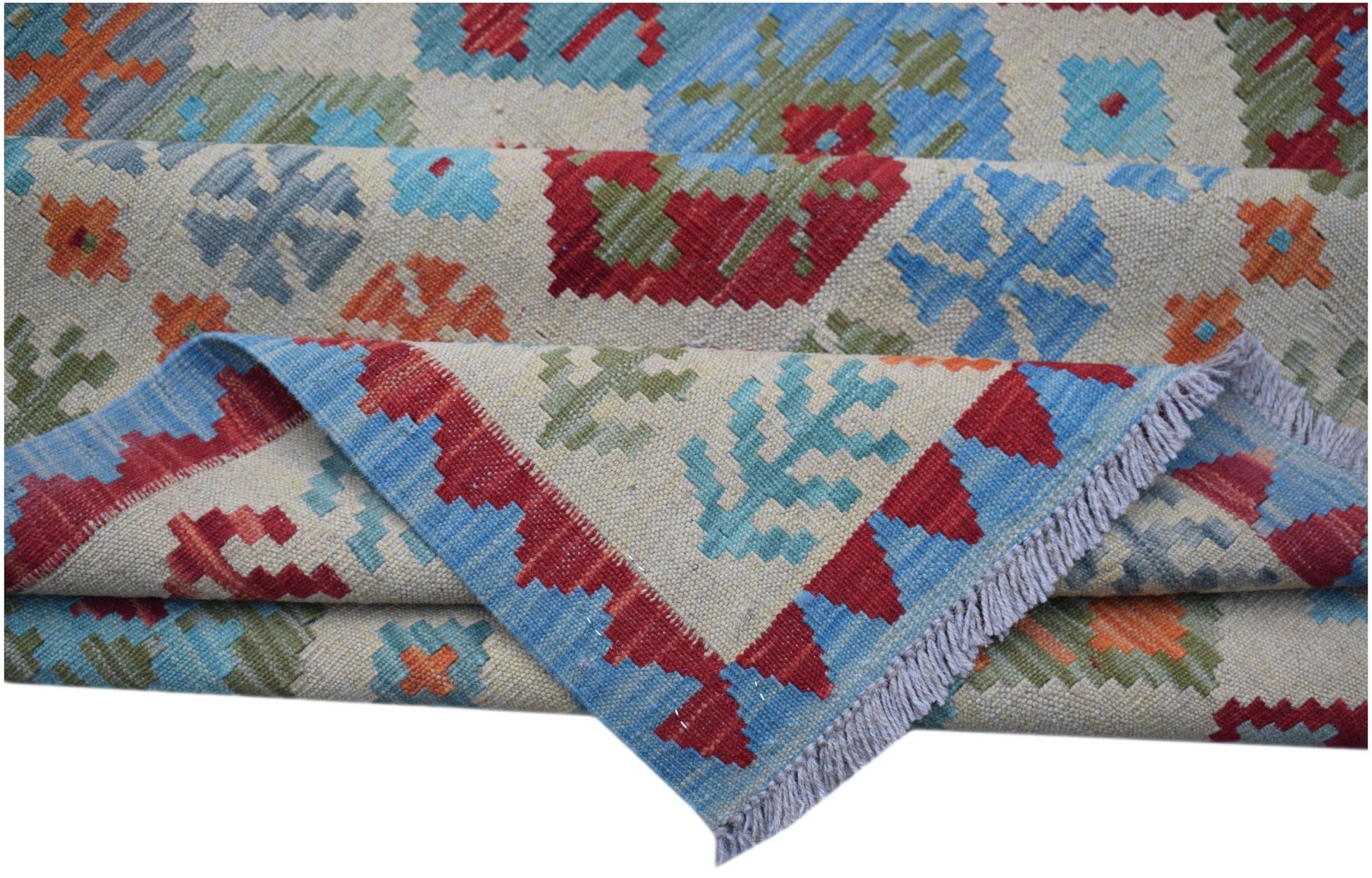 Handwoven Afghan Maimana kilim rug featuring a geometric pattern in red, blue, green, and orange.