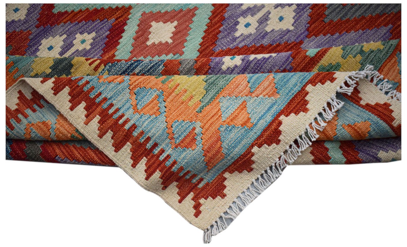 Afghan Maimana Kilim with geometric patterns in red, blue, purple, and orange.