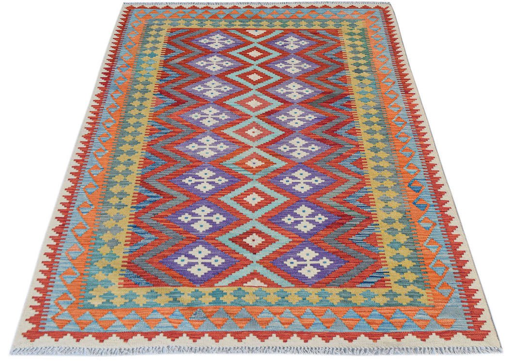 Afghan Maimana Kilim with geometric diamond patterns in red, purple, and blue.