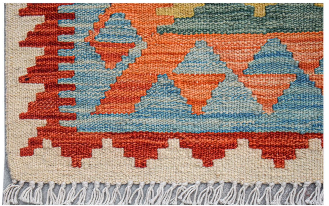 Afghan Maimana Kilim with geometric patterns in red, blue, and green.