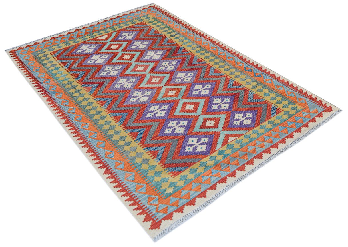 Handwoven Afghan Maimana kilim rug featuring a colorful geometric diamond pattern in wool.