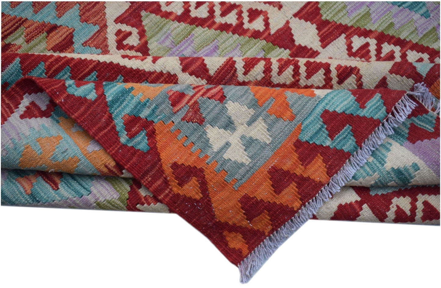 A handwoven Afghan Maimana kilim featuring geometric patterns in red, orange, blue, and green.