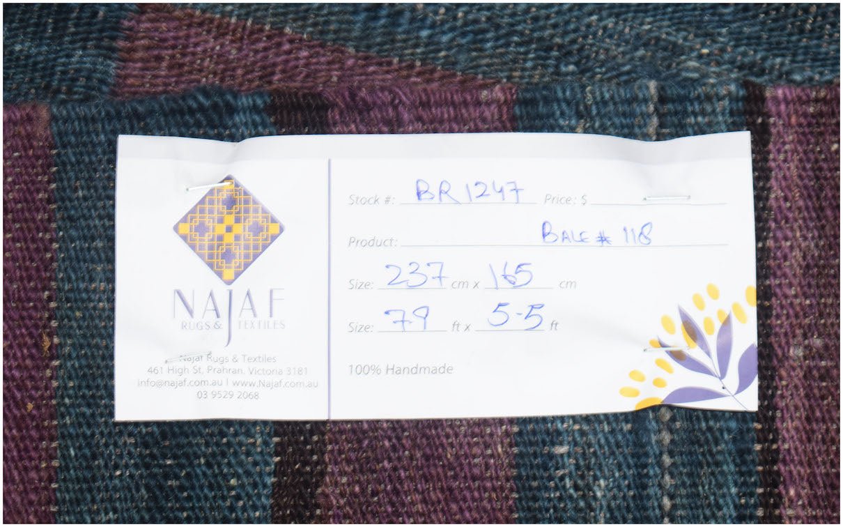 A handmade Afghan Maimana kilim featuring a flatweave texture with dark blue and purple stripes.