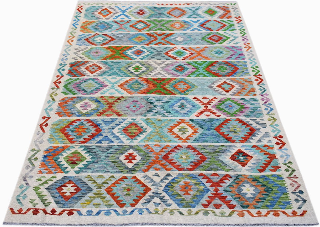 Handwoven Afghan Maimana kilim rug featuring a colorful geometric pattern in wool.
