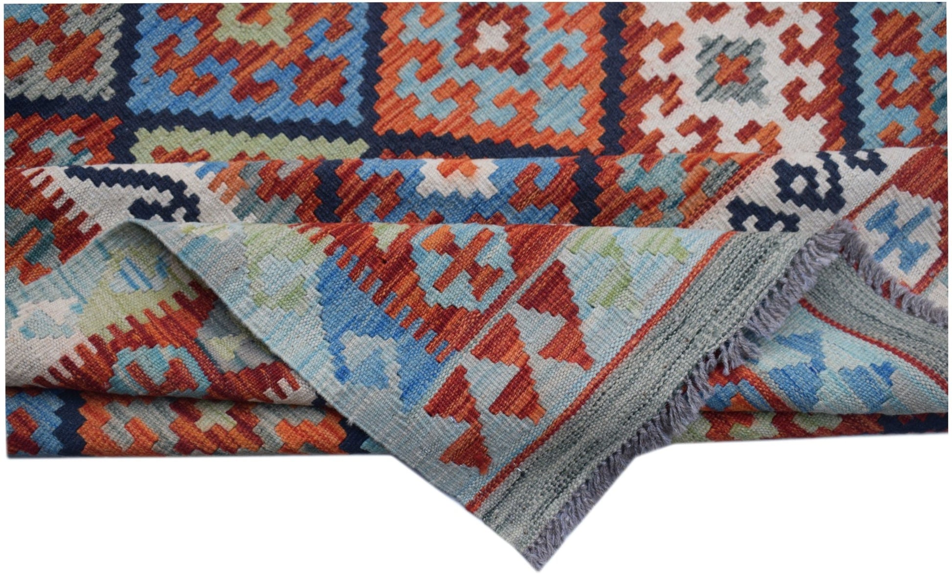Handwoven Afghan Maimana kilim rug featuring a geometric pattern in blue, orange, and cream wool.