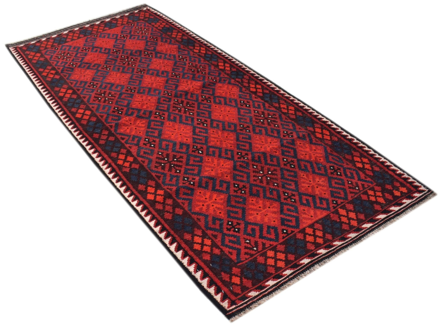 A rectangular Afghan Maimana Kilim rug featuring a geometric pattern in red and dark blue wool.