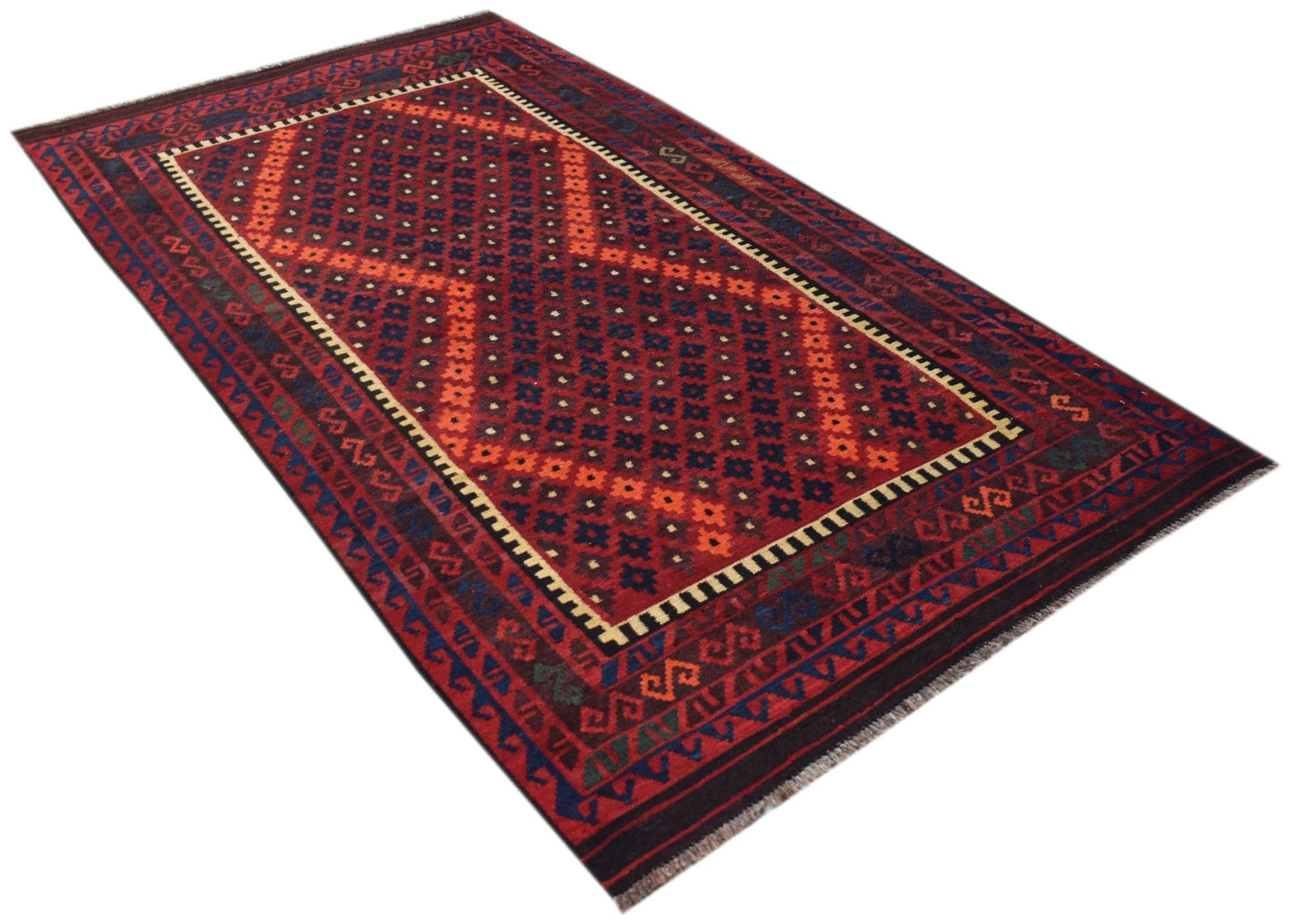 Handwoven Afghan Maimana kilim featuring a geometric diamond pattern in red, blue, and orange.